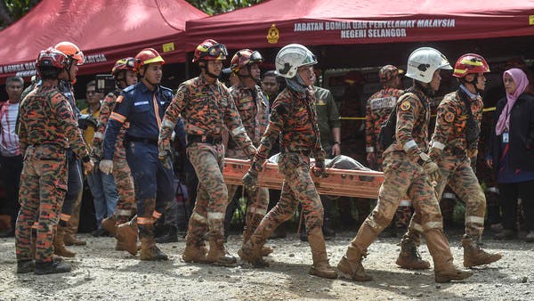 ماليزيا: 16 قتيلا و 17 في عداد المفقودين اثر انهيار معسكر سياحي