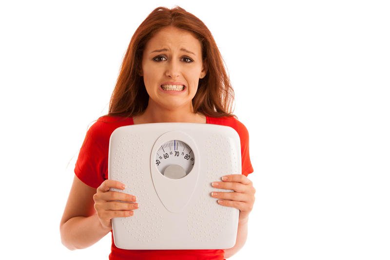 هل الدورة الشهرية تزيد الوزن